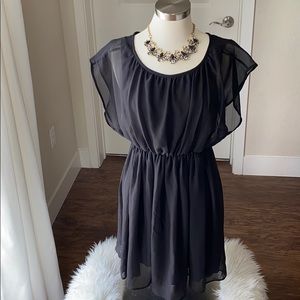 Black flutter sleeve sheer dress.